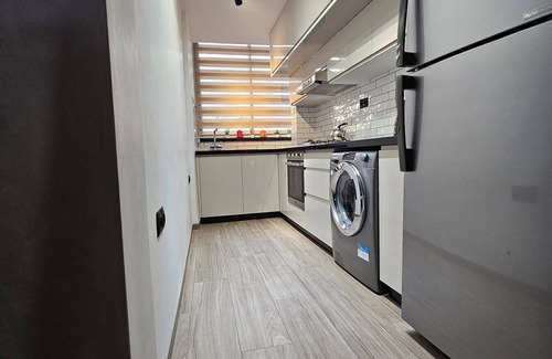 Cite Al Mohammadi Apartment | Inviting Three-Room Apartment with Ocean View & Parking