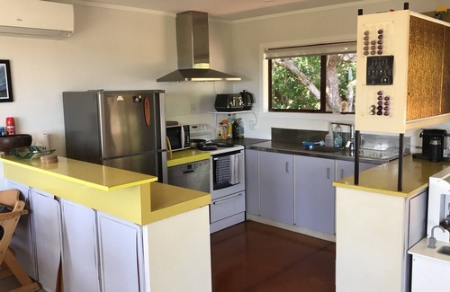 Piha House | Inviting Beachfront Family Bach with Pool & Ocean View