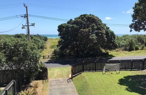 Piha House | Inviting Beachfront Family Bach with Pool & Ocean View