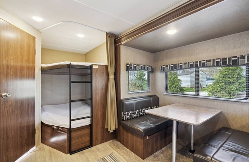 Langworthy RV Rental | Cozy Coleman Camper with Lake View & Breakfast in Delhi, IA
