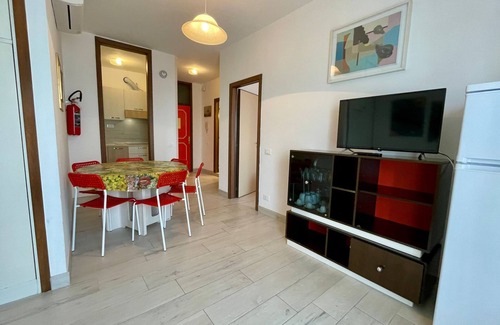 Porto Santa Margherita Apartment | Cozy Retreat with Balcony and Shared Pool - Beahost
