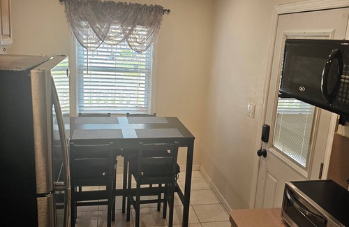 Elmont House | Cozy Getaway: Rated 10/10 with Family-Friendly Amenities