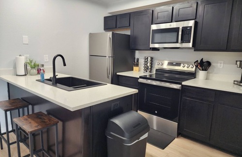 Manhattan Condo | Inviting Condo at Stadium Place with Pool and Breakfast