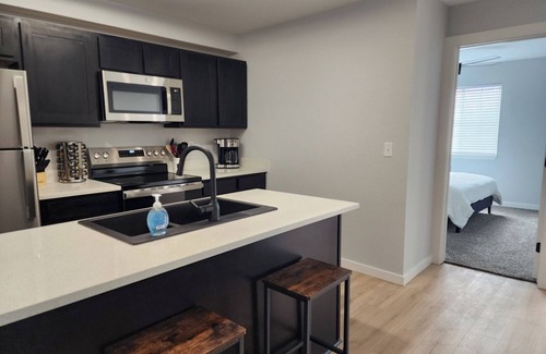 Manhattan Condo | Inviting Condo at Stadium Place with Pool and Breakfast