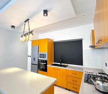 Okpanam Apartment | Inviting Consume Maisonette with Pool and Hot Tub Access