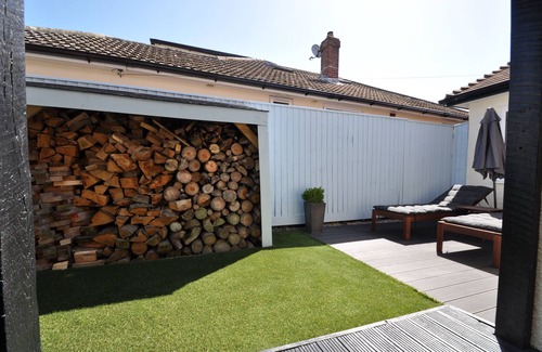 Southbourne Apartment | Stylish Garden Apartment Steps from the Beach with Pool
