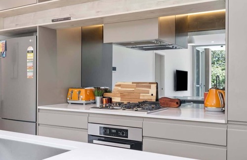 Gosford Apartment | Bright Coastal Retreat with Panoramic Water Views