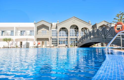 El Cotillo Hotel | Serene Coral Cotillo Beach: Oceanfront Retreat with Pool