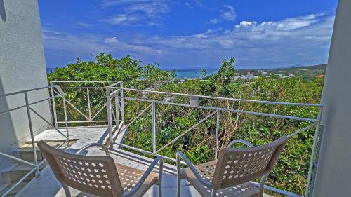 Kadena-cho Apartment | Inviting Coral Garden with 7 Pools and Private Hot Tub