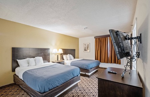 Wichita Hotel | Coratel Plus: Inviting 2 Queen Bed Suite with Breakfast