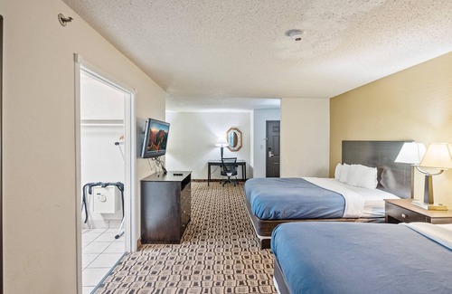 Wichita Hotel | Coratel Plus: Inviting 2 Queen Bed Suite with Breakfast