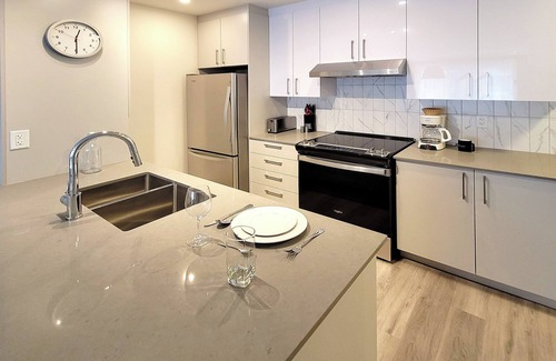 Brossard Apartment | Corporate Stays - 5mins from Walmart Modern 1BR at Blum with Premium Amenities