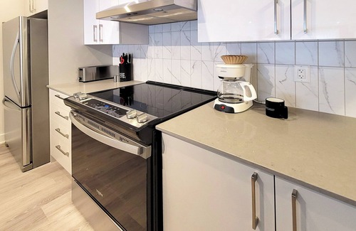 Brossard Apartment | Corporate Stays - 5mins from Walmart Modern 1BR at Blum with Premium Amenities