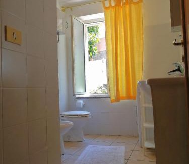 Porto Pozzo Apartment | Inviting Corte Mannoni with Ocean Views and Family Amenities