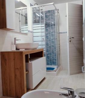 Porto Pozzo Apartment | Inviting Corte Mannoni with Ocean Views and Family Amenities