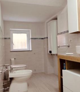 Porto Pozzo Apartment | Inviting Corte Mannoni with Ocean Views and Family Amenities