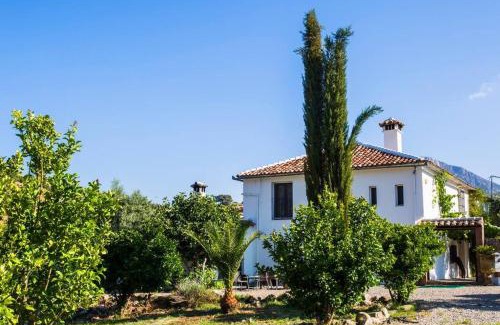 Grazalema House | Elegant Cortijo Grazalema: Poolside Retreat for Families