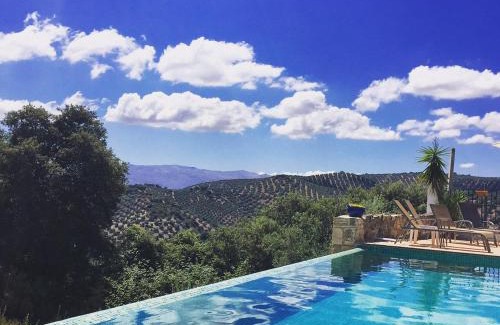 Iznajar Bed & Breakfast | Relax at Cortijo La Haza: 4-Star Oceanfront Retreat