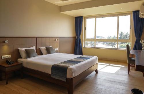 Margao Hotel | Relax at Cosmique Clarks Inn Suites Goa with Pool & Dining