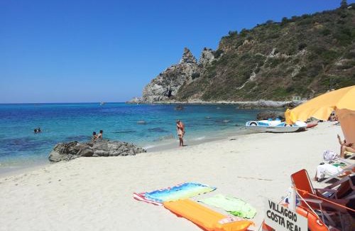 Ricadi Resort | Discover Villaggio Costa Real: Oceanfront Retreat with Pool