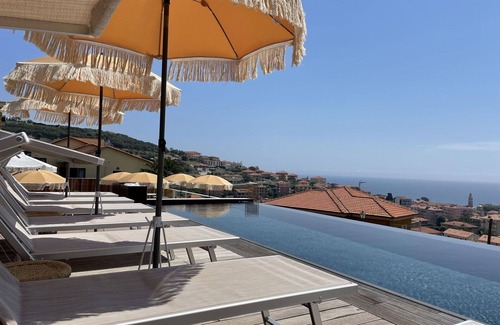 San Lorenzo al Mare Apartment | Cozy Apartment with Pool and Ocean Views for 4 Guests