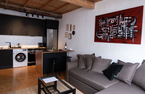 La Coruna Condo | Charming City Center Flat with Spa and Family Amenities