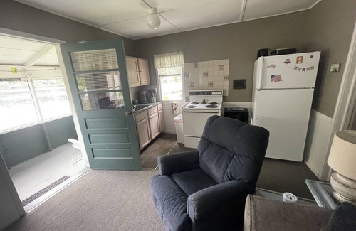 Ludington Cottage | Cozy Cottage 3: Lake View & Steps from Hamlin Dock