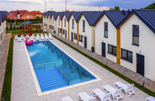 Rewal House | Relaxing Holiday Complex with Pool in Rewal - 4-Star Stay