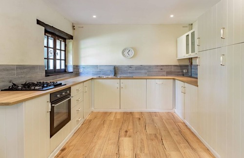 Guerquesalles Cottage | Relaxing Cottage with Pool, Hot Tub & Tennis Amenities