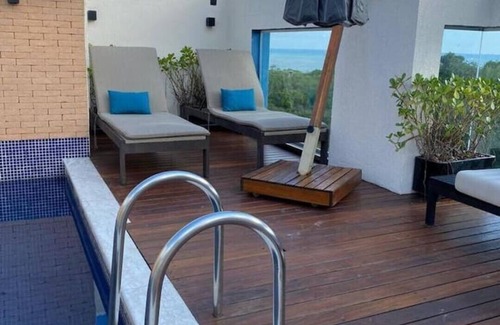 Tombo Apartment | Relax by the Heated Pool with Beach Service Awaits You