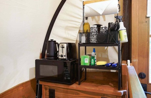 Strasburg RV Rental | Idyllic Covered Wagon Camping Experience by the Creek