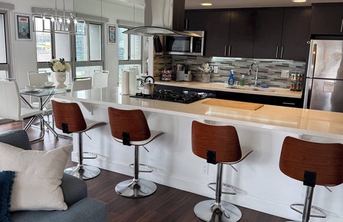 Vernon Apartment | Cozy 2-bedroom corner unit skyrise apartment with city views
