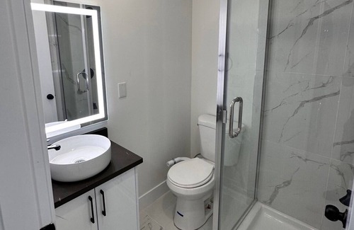 Delta House | Cozy 2-bedroom guest suite available for your vacation.