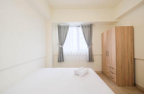 Cikarang Apartment | Inviting 2BR Retreat at Meikarta Apartment by Travelio