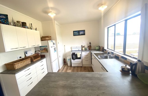 Te Akau House | Idyllic Riverfront Retreat with Family-Friendly Amenities