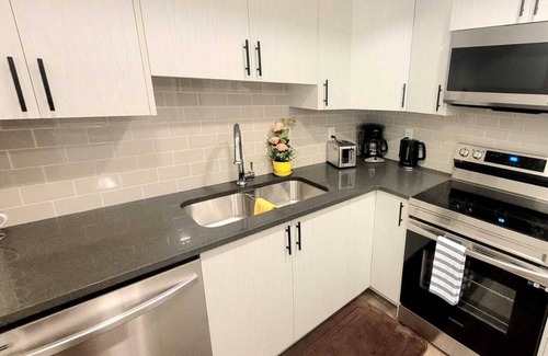 Southeast Calgary House | Inviting 2-Bedroom Retreat with Free Parking & Breakfast