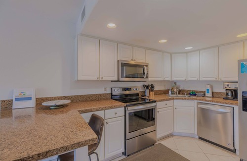 Pensacola Beach House | Charming Beach Bungalow with Ocean View & Pool Access