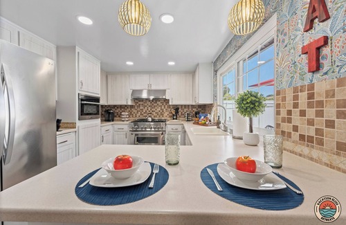 Fire Mountain House | Poolside Oasis: Oceanfront Retreat with Spa & Game Room