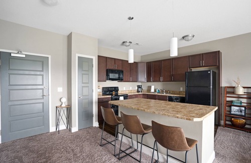 West Des Moines Apartment | Inviting Balcony Retreat with Pool and Pet-Friendly Perks