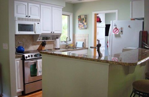 West Beach Cottage | Charming Cottage with Lagoon View, Steps from Beach & Pool