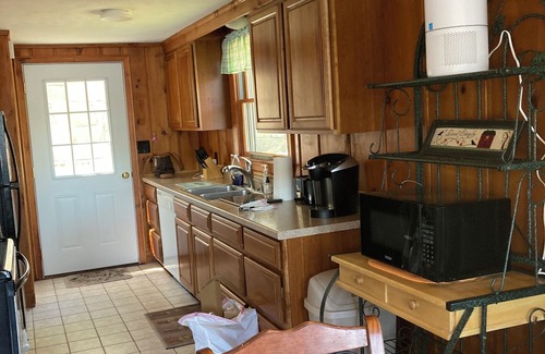 Weare Cottage | Charming Lakefront Cottage with Pool and Hot Tub