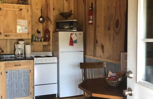 Perkinston Cabin | Serene Creekside Cabin Retreat with Pool and Breakfast