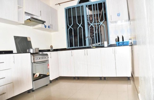Kigali House | Inviting Double Room with Workspace & Private Bath in Kigali