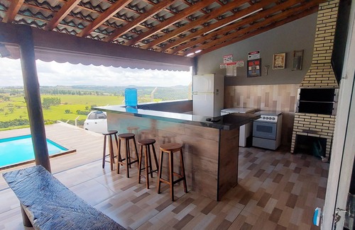 Sao Sebastiao do Paraiso House | Charming Farmhouse Retreat in Minas Gerais with Scenic Views