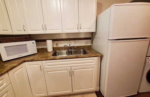 Langley House | Inviting Main Floor Suite with Pool & Spa in Quiet Area