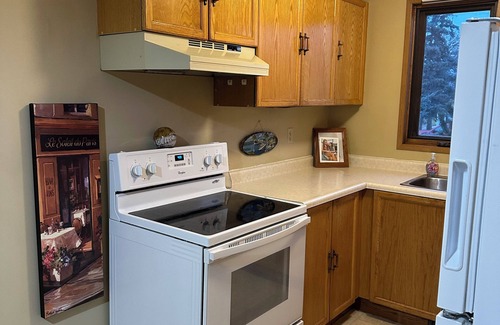 Taber House | Cozy Getaway: 2-Story Bungalow in Taber: Old-Fashioned Charm with big trees.