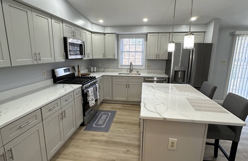 Worcester House | Inviting Home Near Shopping Center with Two Kitchens & Living Rooms