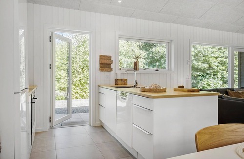 Helberskov Strand House | Inviting Cottage with Scenic Views of Mariager Fjord