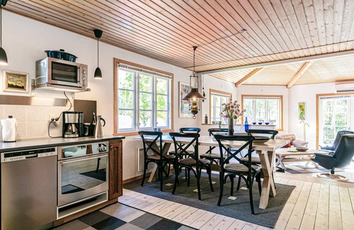 Bedegaard House | Cozy Family Getaway: Embrace Nature in a Red Wooden House