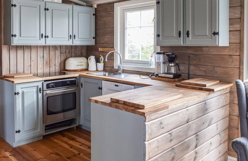 Sjusjoen House | Experience Nature in a Cozy Wooden Cottage Retreat